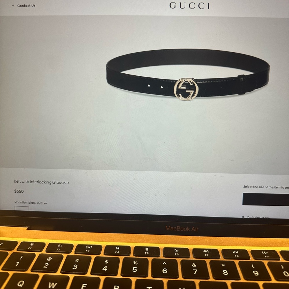 Gucci Black Leather Belt with Embossed Logo